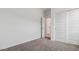 Well-lit bedroom with plush carpeting and mirrored closet doors at 1543 E Lardner Dr, Casa Grande, AZ 85122