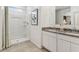 Bathroom with double vanity, granite countertop, and shower at 1552 E Mason Dr, Casa Grande, AZ 85122