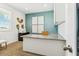 Home office with granite desk and teal accent wall at 1552 E Mason Dr, Casa Grande, AZ 85122