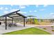 Community playground with shaded seating area at 1552 E Mason Dr, Casa Grande, AZ 85122
