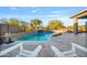 Resort style pool with a waterfall and plenty of space for relaxation at 16480 W Catalina Dr, Goodyear, AZ 85395