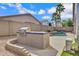 Landscaped backyard showcases a built-in grill and a refreshing pool, perfect for outdoor entertaining at 1699 E Hearne Way, Gilbert, AZ 85234