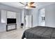 This spacious main bedroom features tile flooring, neutral paint, and a ceiling fan with a light at 1699 E Hearne Way, Gilbert, AZ 85234