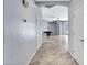 Hallway with tile floors leading to a bright living area, showcasing modern home design at 1699 E Hearne Way, Gilbert, AZ 85234