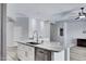 Open kitchen featuring a large granite island, stainless steel appliances, and lots of natural light at 1699 E Hearne Way, Gilbert, AZ 85234