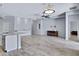 Spacious living room featuring a large island bar, tile floors, and bright recessed lighting at 1699 E Hearne Way, Gilbert, AZ 85234