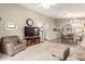 Bright living room with hardwood floors and view to the dining area at 17240 W Banff Ln, Surprise, AZ 85388