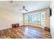 Living area featuring wood flooring and bay window at 18747 N Sunsites Dr, Surprise, AZ 85387