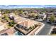 Captivating aerial view of a home with a cozy backyard, pool, and tasteful landscaping, perfect for outdoor living at 18906 E Cattle Dr, Queen Creek, AZ 85142