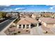 Charming house featuring a well-maintained tile roof, desert landscaping, and an attached garage in a friendly neighborhood at 18906 E Cattle Dr, Queen Creek, AZ 85142
