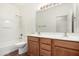 This is a full bathroom featuring a double sink vanity, a shower-tub combo, and neutral tile floors at 18906 E Cattle Dr, Queen Creek, AZ 85142