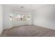 Spacious bedroom with neutral carpet, ceiling fan, and large windows providing plenty of natural light at 18906 E Cattle Dr, Queen Creek, AZ 85142