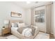 Cozy bedroom featuring a comfortable bed, stylish decor, and soft lighting at 18906 E Cattle Dr, Queen Creek, AZ 85142