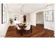 Elegant dining room featuring modern lighting, hardwood floors, and stylish decor at 18906 E Cattle Dr, Queen Creek, AZ 85142