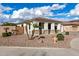 Well-maintained single-story home with desert landscaping and a two-car garage at 18906 E Cattle Dr, Queen Creek, AZ 85142