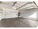 Spacious garage with ample room for storage and parking, featuring a water heater and utility sink at 18906 E Cattle Dr, Queen Creek, AZ 85142