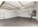 Clean and organized garage space featuring ample shelving for storage and efficient layout at 18906 E Cattle Dr, Queen Creek, AZ 85142