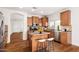 Spacious kitchen featuring stainless steel appliances, granite countertops, and a breakfast bar at 18906 E Cattle Dr, Queen Creek, AZ 85142