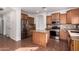 Well-lit kitchen features stainless steel appliances, granite countertops, tile backsplash, and large center island at 18906 E Cattle Dr, Queen Creek, AZ 85142