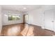 This living room has a door, a window, and light-colored wood-look flooring at 18906 E Cattle Dr, Queen Creek, AZ 85142