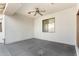 This outdoor covered patio includes a ceiling fan, offering a perfect blend of comfort and style at 18906 E Cattle Dr, Queen Creek, AZ 85142
