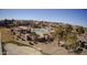 A beautiful community pool with seating areas and green landscaping, nestled within a neighborhood of well-kept homes at 18906 E Cattle Dr, Queen Creek, AZ 85142
