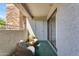 Cozy outdoor balcony with two chairs perfect for relaxing and enjoying the neighborhood views at 2025 E Campbell Ave # 140, Phoenix, AZ 85016