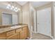 Bathroom featuring vanity with granite countertop and large mirror at 2025 E Campbell Ave # 140, Phoenix, AZ 85016