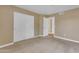 Bedroom with neutral carpet and wall color and a large closet at 2025 E Campbell Ave # 140, Phoenix, AZ 85016