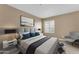 Cozy bedroom with plush carpet, neutral walls, and a comfortable bed with a decorative throw at 2025 E Campbell Ave # 140, Phoenix, AZ 85016