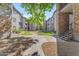 The center courtyard has green grass, sidewalks, stone accents and many apartment buildings at 2025 E Campbell Ave # 140, Phoenix, AZ 85016