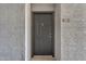 Apartment front door features a gray finish, door knocker, and apartment number at 2025 E Campbell Ave # 140, Phoenix, AZ 85016