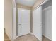 Hallway with large closet and neutral tile flooring at 2025 E Campbell Ave # 140, Phoenix, AZ 85016