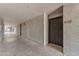 Apartment hallway view of the building featuring textured walls, and building access stairs at 2025 E Campbell Ave # 140, Phoenix, AZ 85016