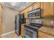 Modern kitchen with stainless steel appliances and beautiful granite countertops at 2025 E Campbell Ave # 140, Phoenix, AZ 85016