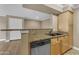 Well-lit kitchen featuring granite countertops and stainless steel dishwasher at 2025 E Campbell Ave # 140, Phoenix, AZ 85016