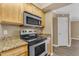 Well-equipped kitchen with stainless steel appliances and granite countertops at 2025 E Campbell Ave # 140, Phoenix, AZ 85016
