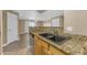 Kitchen sink featuring granite countertops and an open view to the living space at 2025 E Campbell Ave # 140, Phoenix, AZ 85016