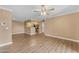 Bright living room with hardwood floors and open floor plan flowing to the kitchen at 2025 E Campbell Ave # 140, Phoenix, AZ 85016
