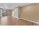 Living room view featuring hardwood floors, sliding glass doors to the outside at 2025 E Campbell Ave # 140, Phoenix, AZ 85016