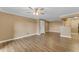 Bright living room with hardwood floors, ceiling fan, and open floor plan at 2025 E Campbell Ave # 140, Phoenix, AZ 85016