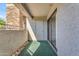Covered patio area with sliding door leading to the home's interior at 2025 E Campbell Ave # 140, Phoenix, AZ 85016