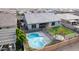 Aerial view of backyard featuring a pool, trampoline, manicured lawn, and seating area at 21716 E Waverly Dr, Queen Creek, AZ 85142