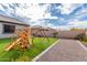 Beautiful backyard with green lawn and play structure, perfect for outdoor fun at 21716 E Waverly Dr, Queen Creek, AZ 85142