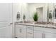 Elegant bathroom with double sinks, granite countertops, and modern fixtures at 21716 E Waverly Dr, Queen Creek, AZ 85142