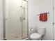 Clean bathroom featuring a glass-enclosed shower, modern toilet, and a towel rack at 21716 E Waverly Dr, Queen Creek, AZ 85142