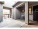 Inviting front porch features dual entry doors and wrought iron bench seating at 21716 E Waverly Dr, Queen Creek, AZ 85142