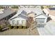 Gorgeous elevated front view of house with neutral tones, well-manicured landscaping, and a grey roof at 21716 E Waverly Dr, Queen Creek, AZ 85142