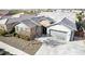 Beautiful aerial front view of house with neutral tones, well-manicured landscaping, and a grey roof at 21716 E Waverly Dr, Queen Creek, AZ 85142