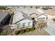 High angle front view of house with neutral tones, well-manicured landscaping, and a grey roof at 21716 E Waverly Dr, Queen Creek, AZ 85142